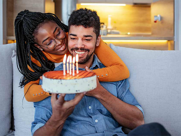 a happy couple celebrating a birthday